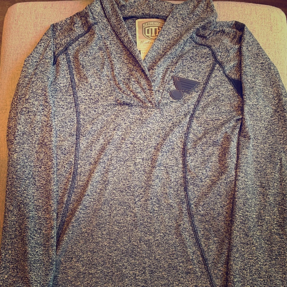 Blues dri-fit material long sleeve V-neck.